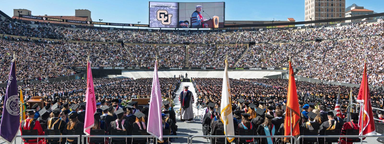 Chancellor Justin Schwartz addresses the crowd at the CU Boulder commencement in 2025