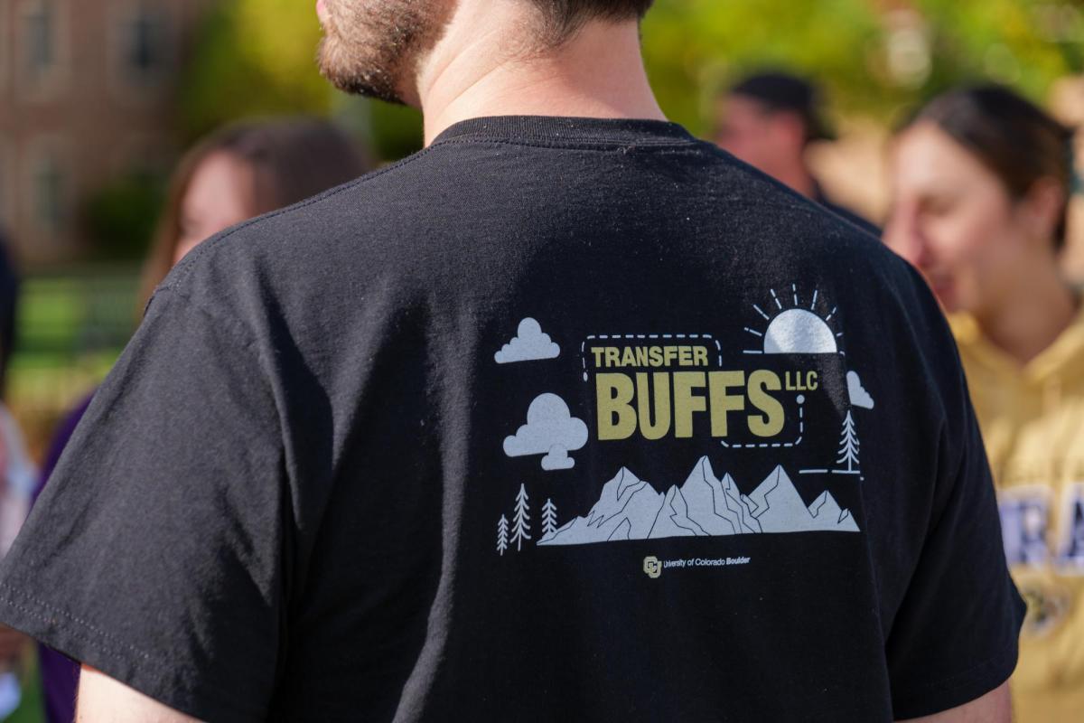 Person wearing a Transfer Buffs LLC t-shirt.