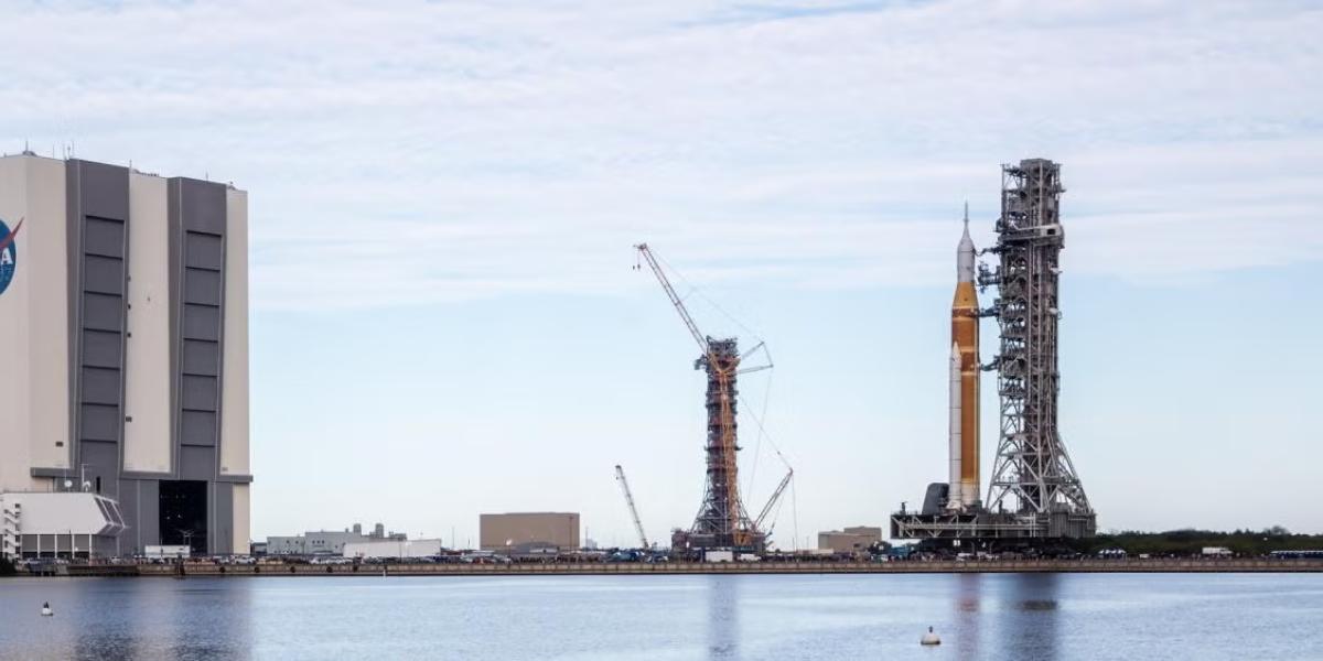 A rocket carrying the Orion spacecraft rolls out for the launch pad at NASA's Kennedy Space Center in Florida.