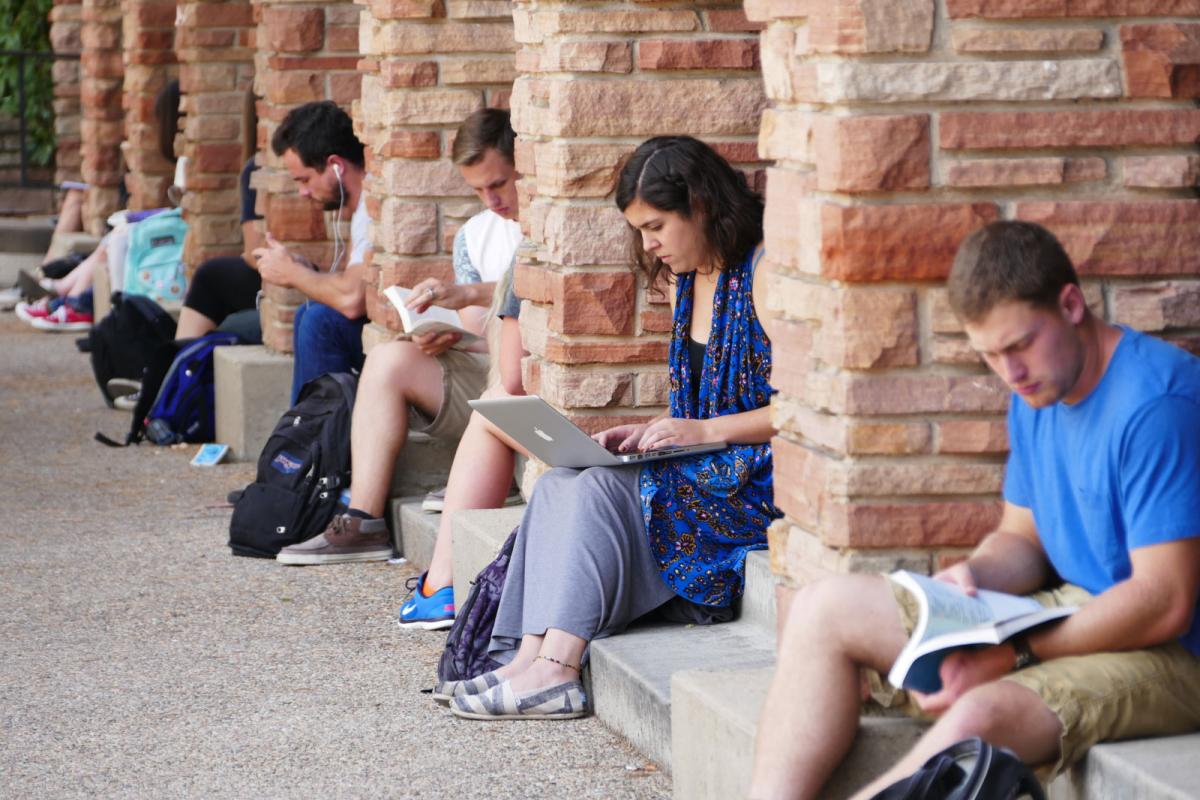 Students sitting outside UMC studying