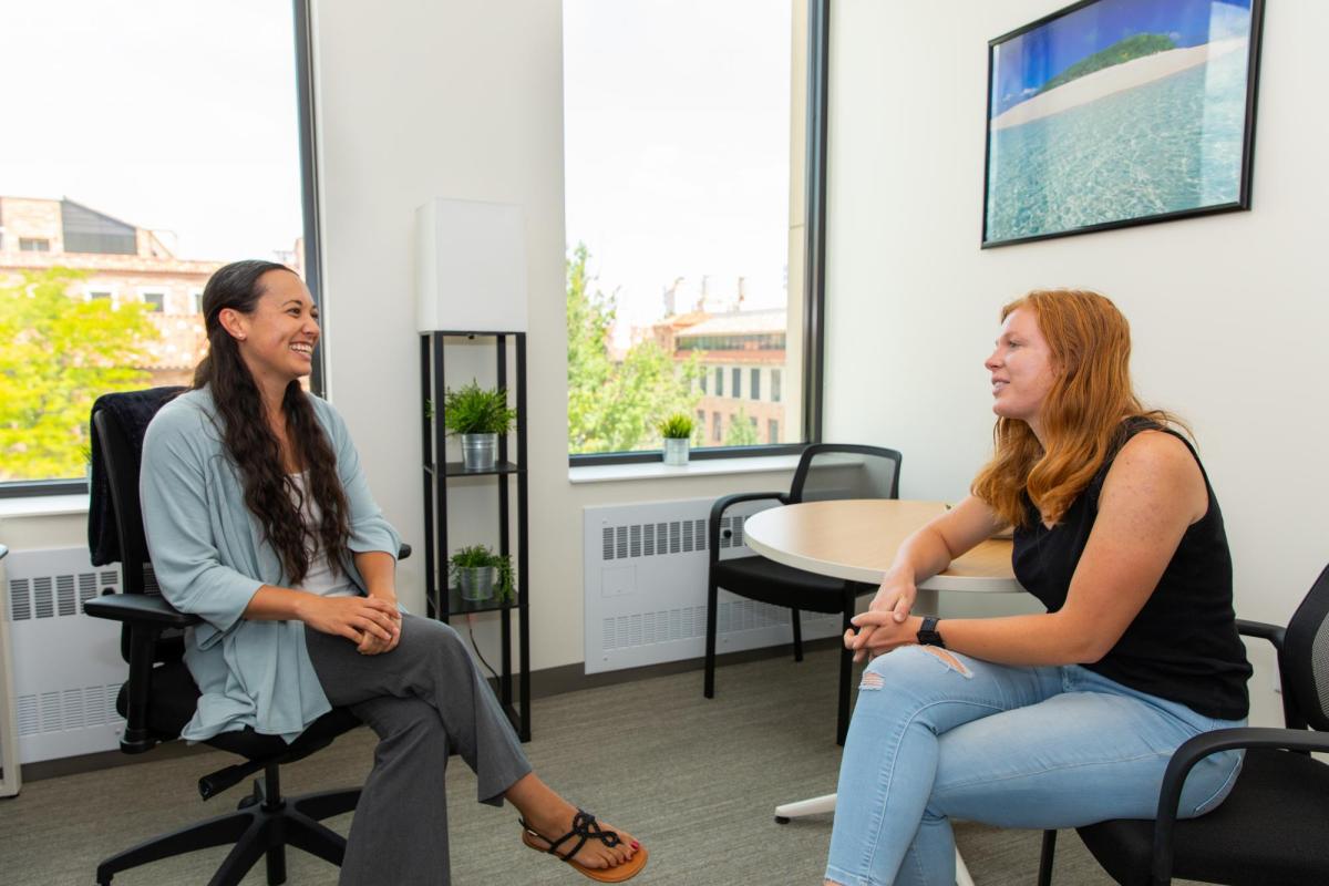 Two people meeting for an advising session.