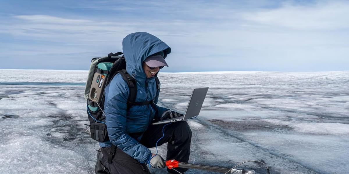 Alia Khan collecting data on the Greenland ice sheet.